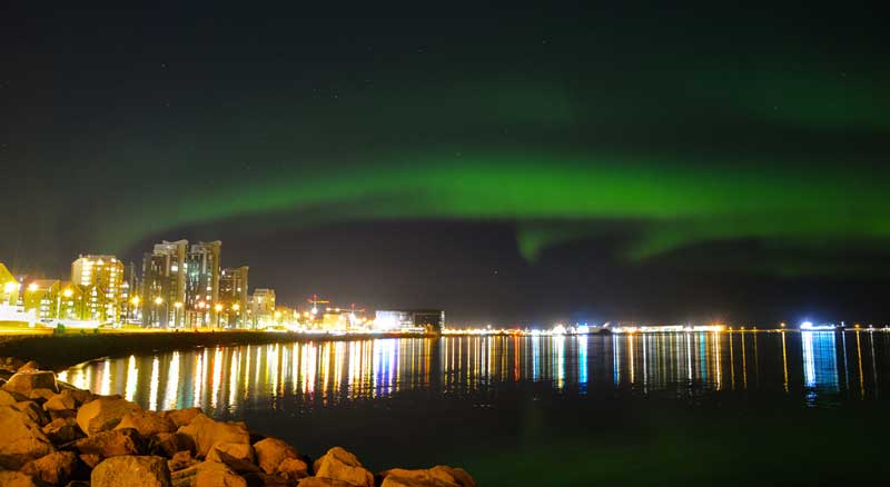 Aurora Borealis over city of Reykjavik
