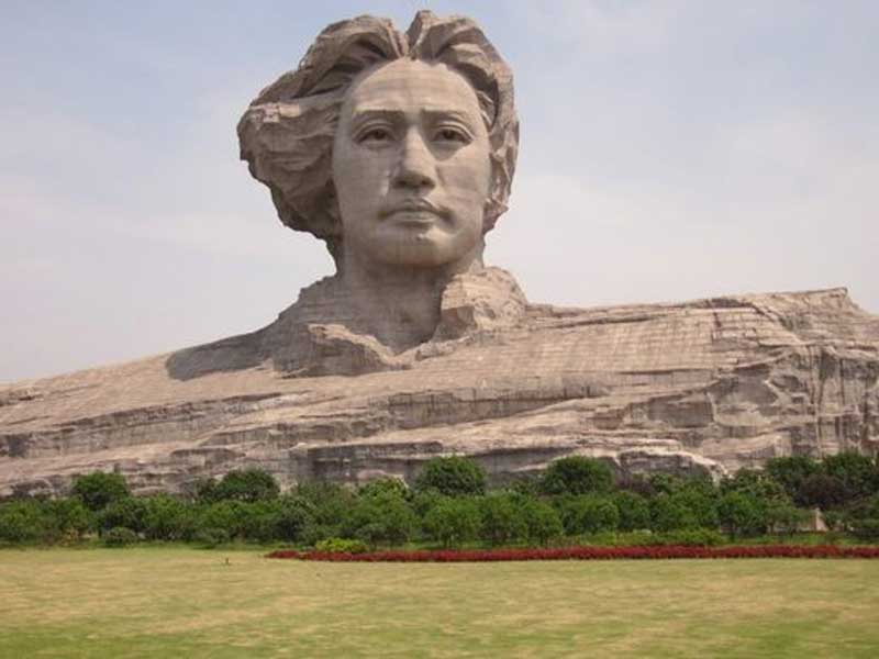 The giant head of young Mao on Changsha river-bound Orange Island